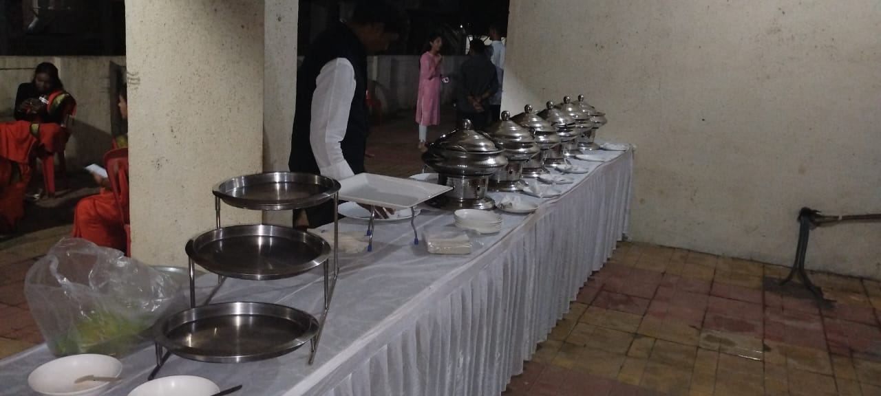 Elegant wedding catering display with floral decorations